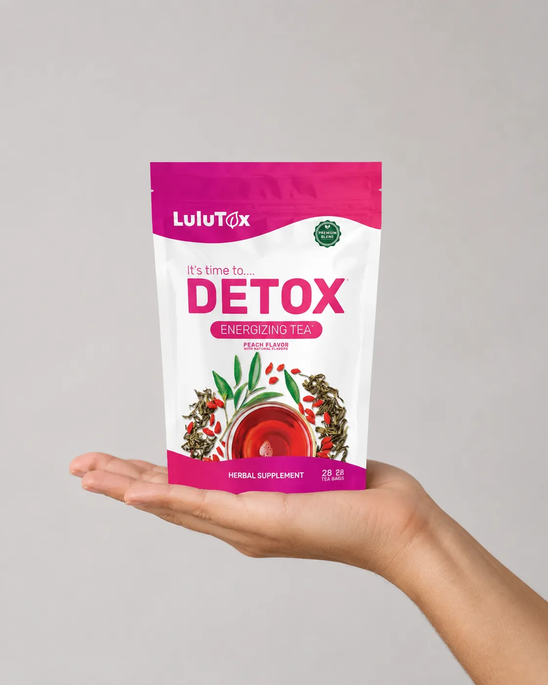 Lulutox Detox Tea HCTC — the package held in a hand